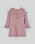 Pink knitted dress with pink details.