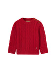 Red cable knit sweater with button details on a white background