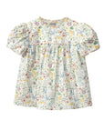 Floral blouse with puff sleeves on a white background