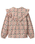 Floral blouse with ruffled collar on a white background