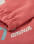 Red sweatshirt with a white flower from MIBONBON