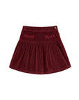 Burgundy velvet skirt with decorative elements