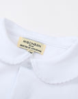 White shirt with a visible brand label on a white background