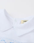 White polo shirt with blue embroidery on a white background