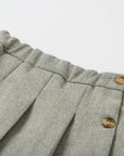 Grey skirt with brown buttons