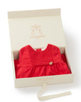Red dress with smocked bodice and flower detail