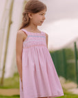 Dress for girl crafted in seersucker with a smocked bodice