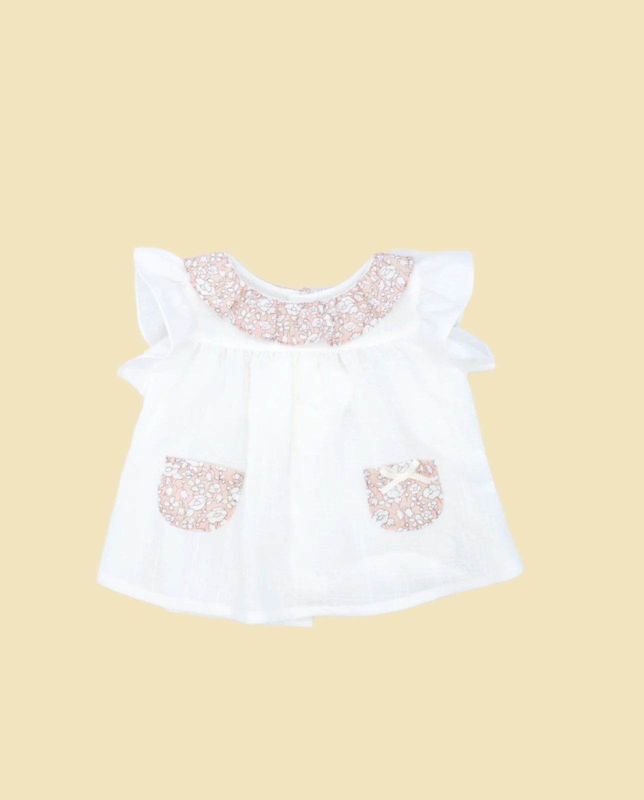 White blouse with pockets and pink flower print ruffle collar