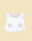 White blouse with pockets and pink flower print ruffle collar