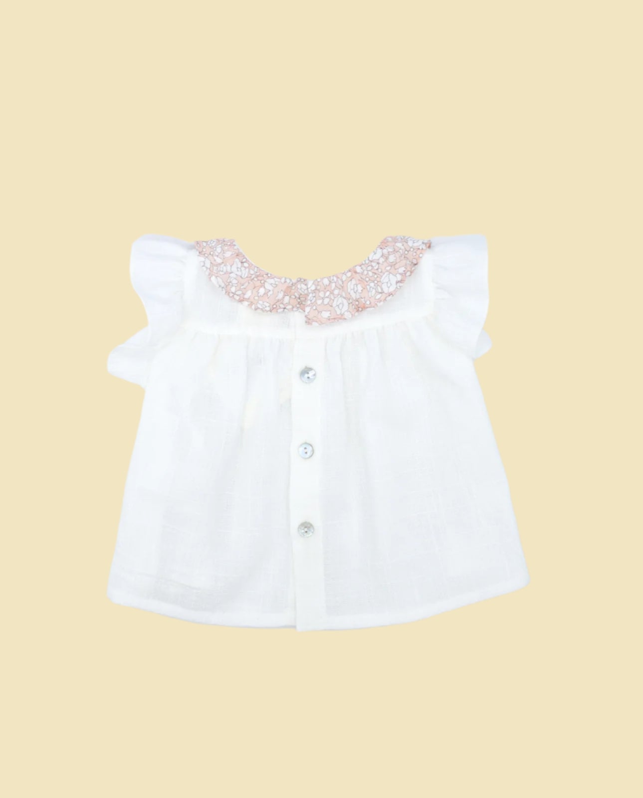 White blouse with pockets and pink flower print ruffle collar