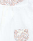 White blouse with pockets and pink flower print ruffle collar