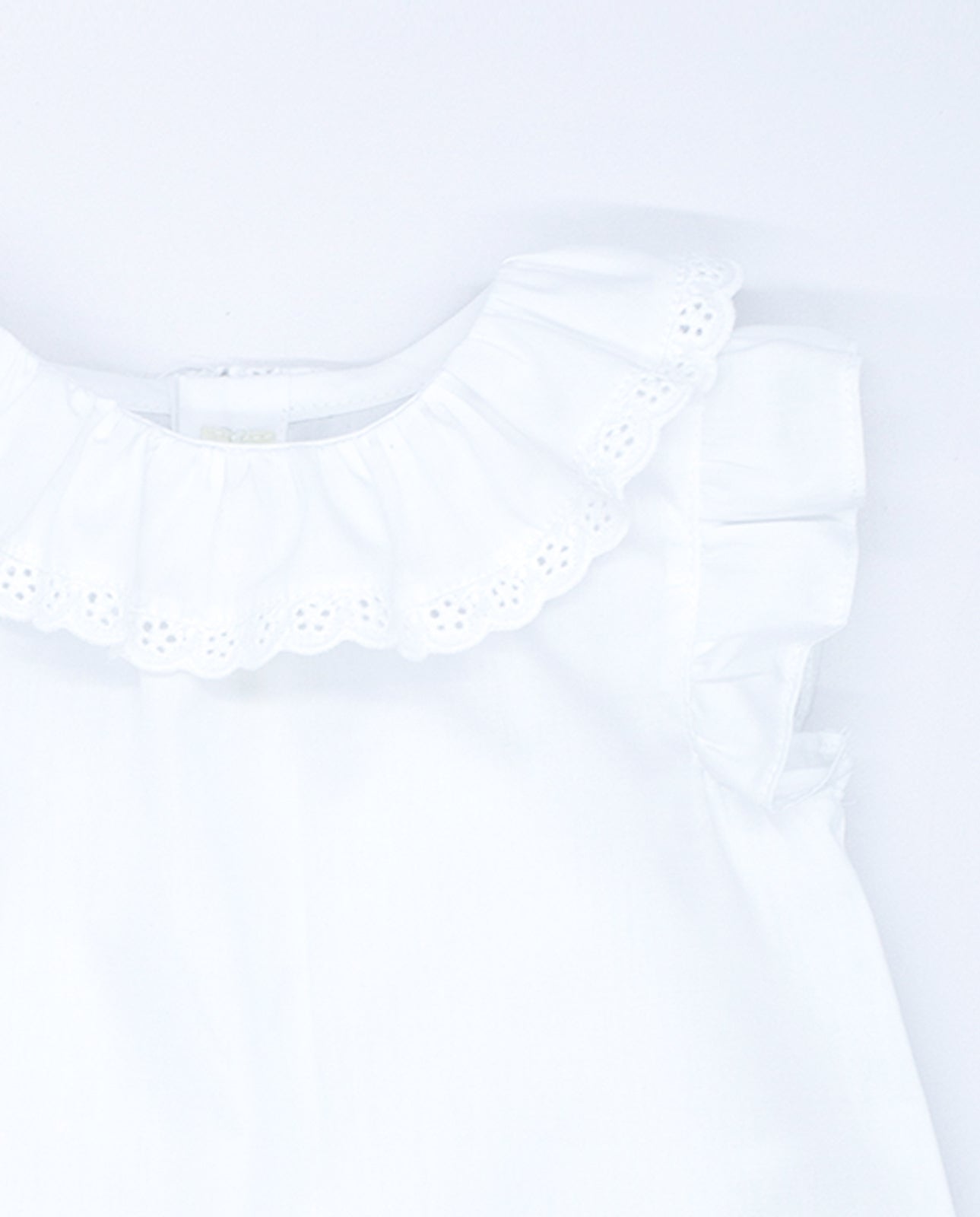 White poplin blouse with embroidered trim