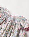 Smocked floral dress with Flutter sleeves