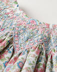 Smocked floral dress with Flutter sleeves