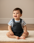 Asian baby boy in blue stripe star tee with navy denim dungaree shorts
