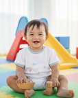 Asian baby boy wearing fish t-shirt in indoor playground