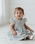 Asian baby girl in blue floral dress