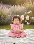 Asian baby in pink ruffle dress – Bonpoint summer style