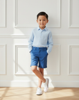 Asian Boy Blue Outfit Relaxed Pose White Sneakers