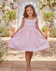 Asian girl in pink smocked dress