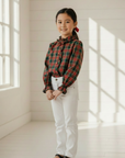 Asian girl in tartan plaid blouse with white pants and elegant shoes