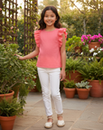 Girl in Coral Ruffle Blouse