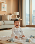Smiling Hong Kong baby boy in white pajama