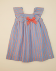 Striped Girls' Dress Flat Lay on Beige Background