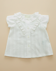 White Ruffle Blouse Professional Flat Lay on Beige