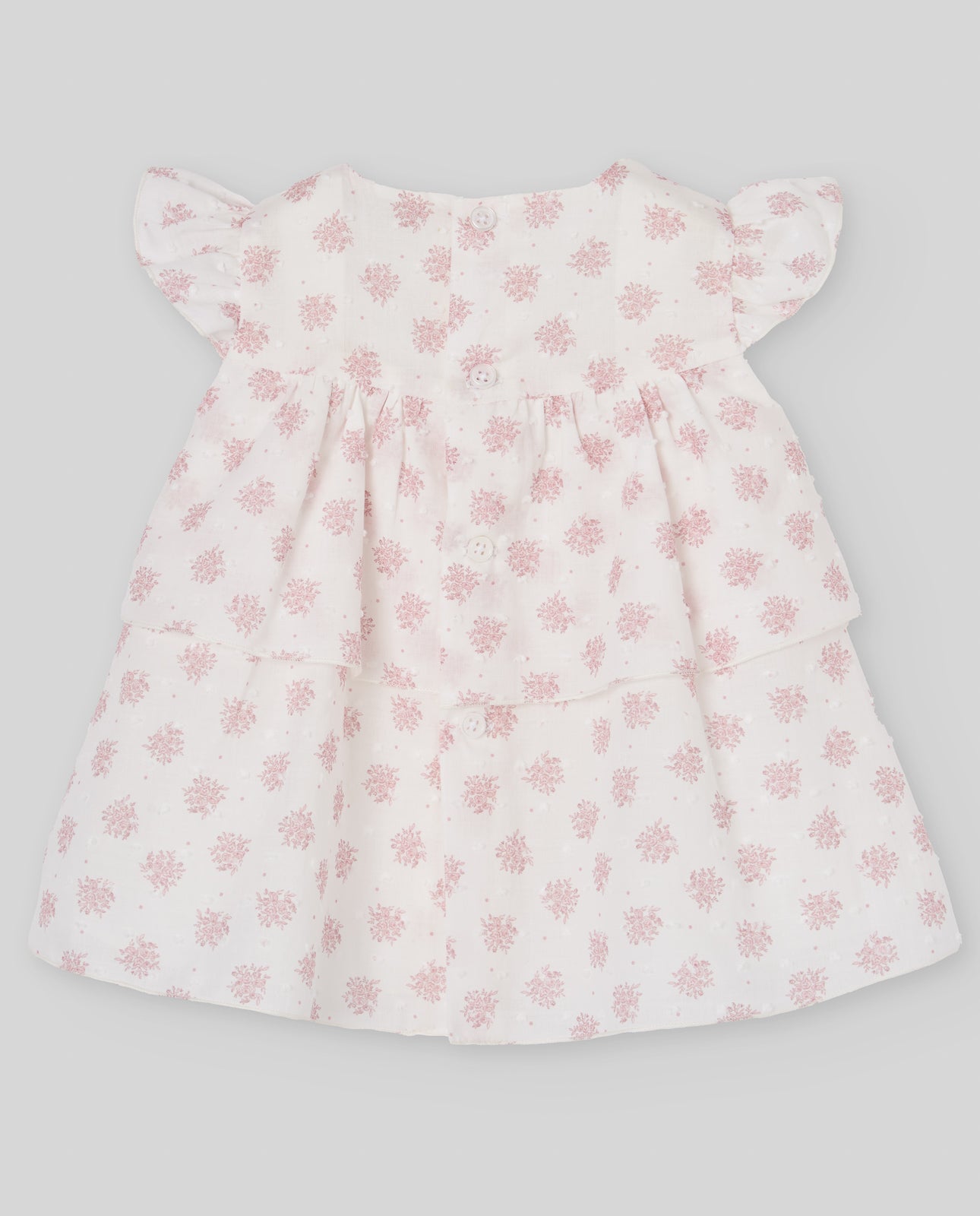 Dress for girl made of printed fabric with delicate plumeti in pink