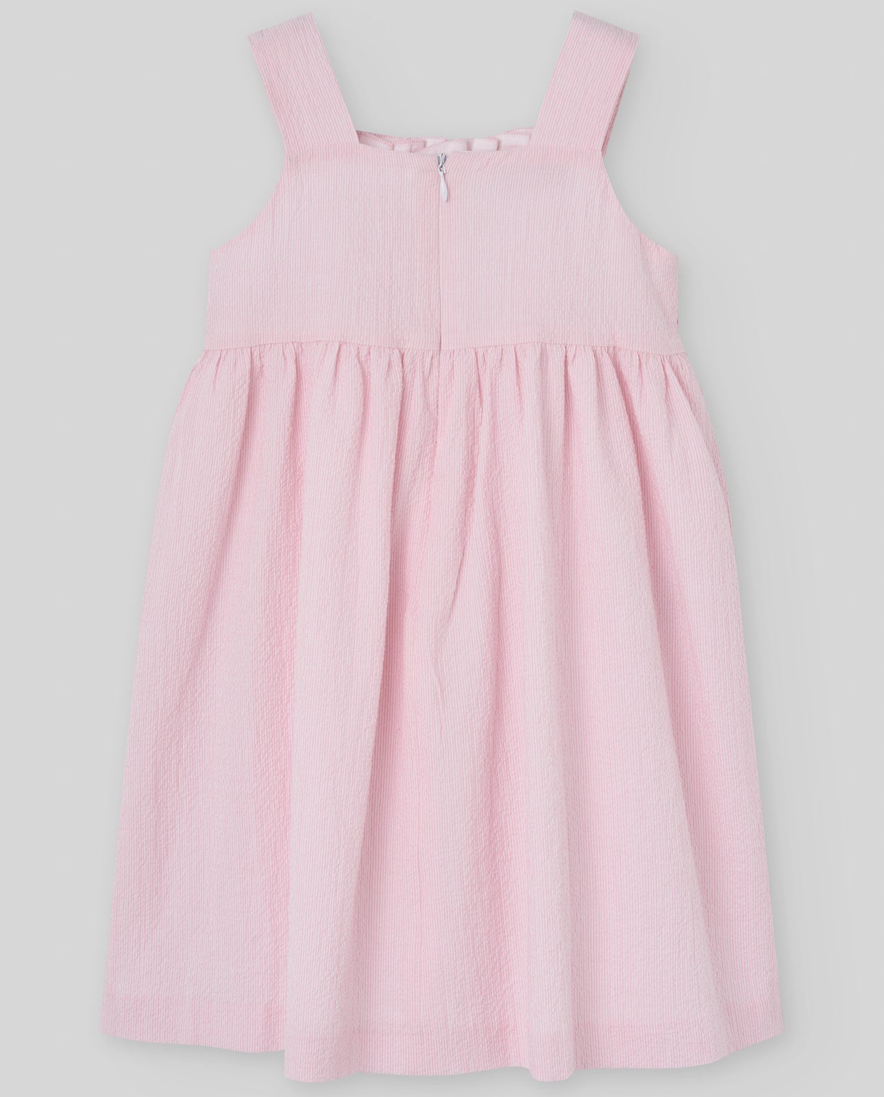 Dress for girl crafted in seersucker with a smocked bodice