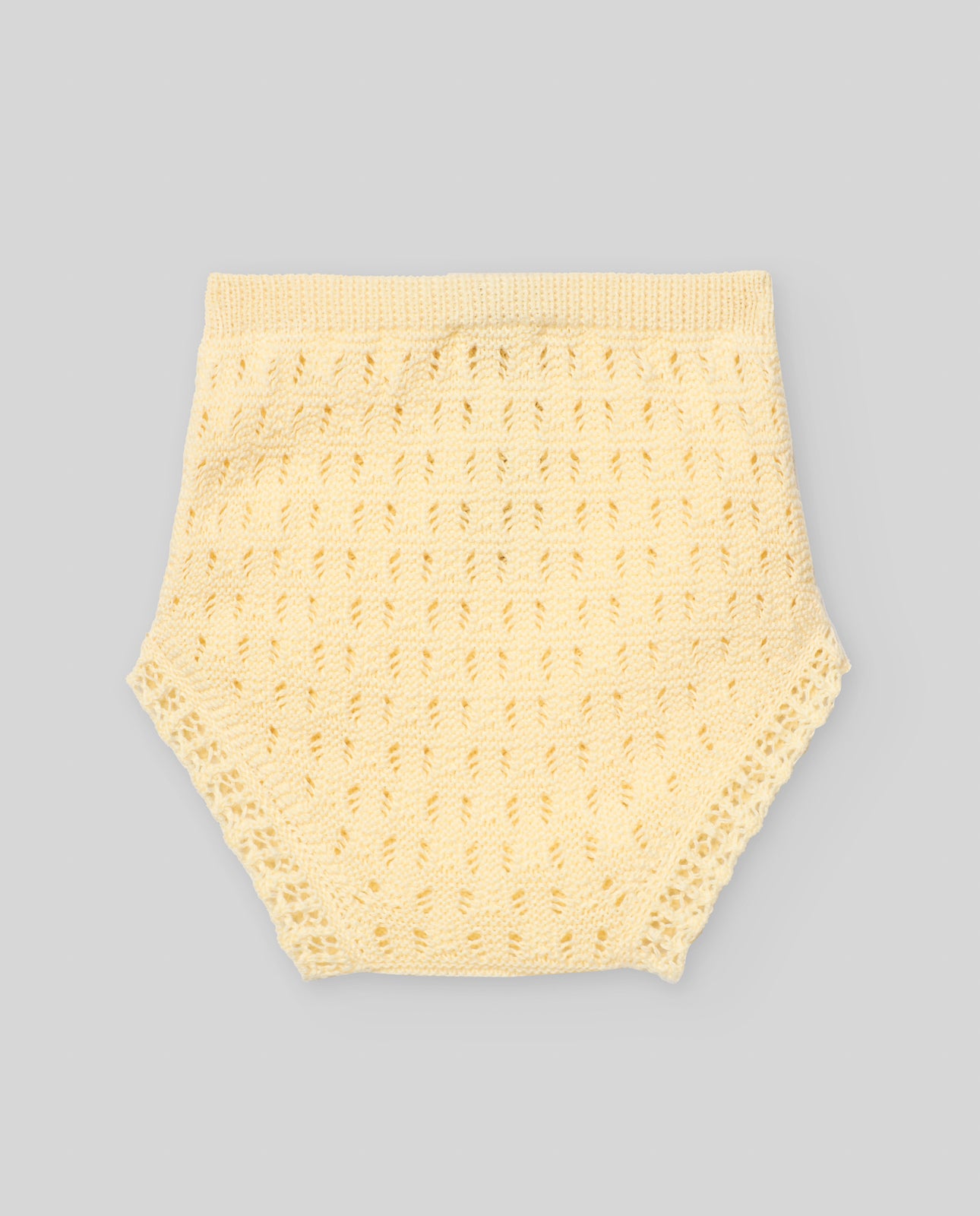 Knitted bloomers with openwork details and hand-finished trim.