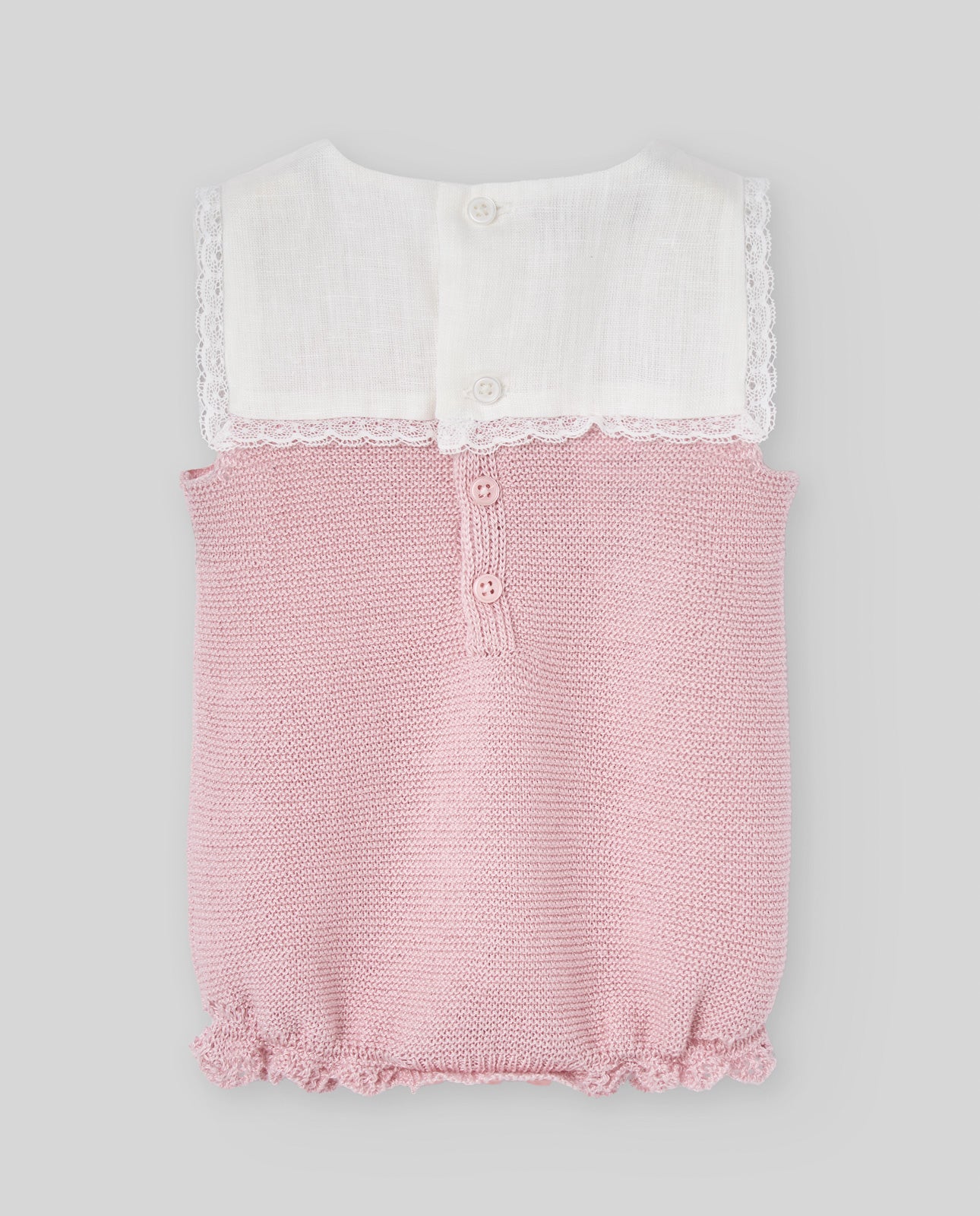 Girl's knitted romper with a pink knit body