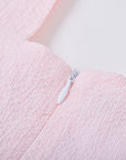Dress for girl crafted in seersucker with a smocked bodice