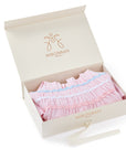 Dress for girl crafted in seersucker with a smocked bodice