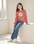 Red sweatshirt with a white flower from MIBONBON