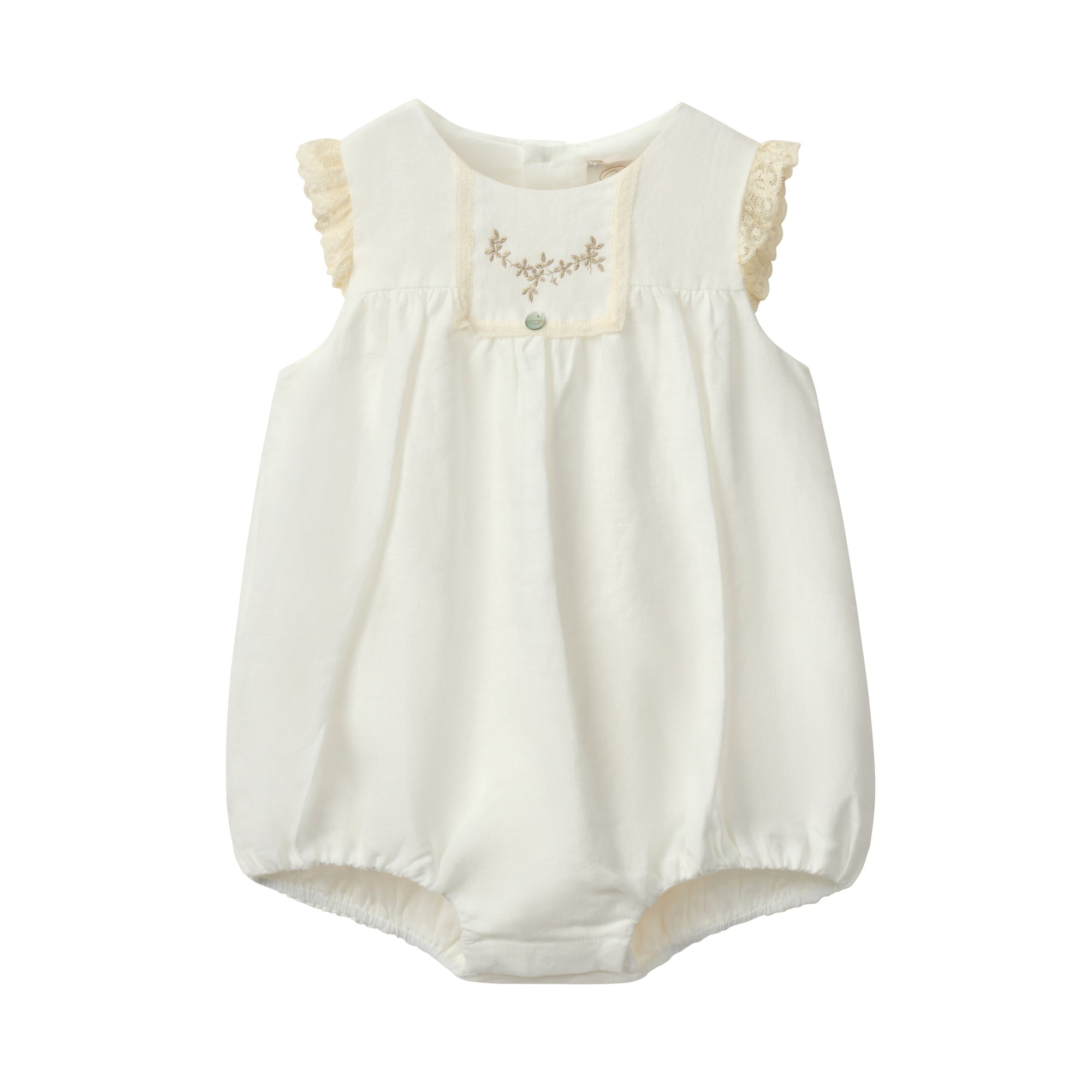 White baby romper with lace details on a white background