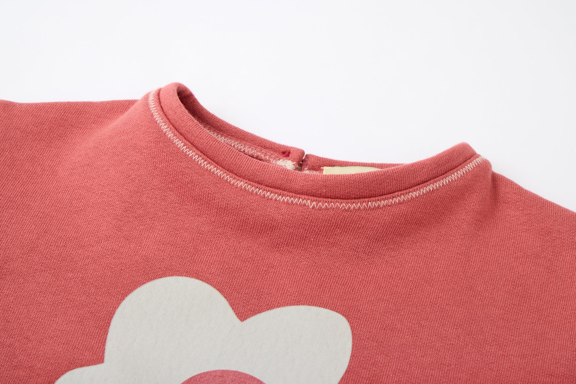 Red sweatshirt with a white flower from MIBONBON