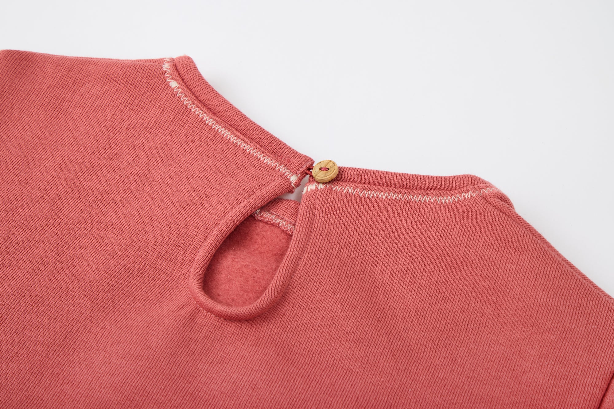 Red sweatshirt with a white flower from MIBONBON
