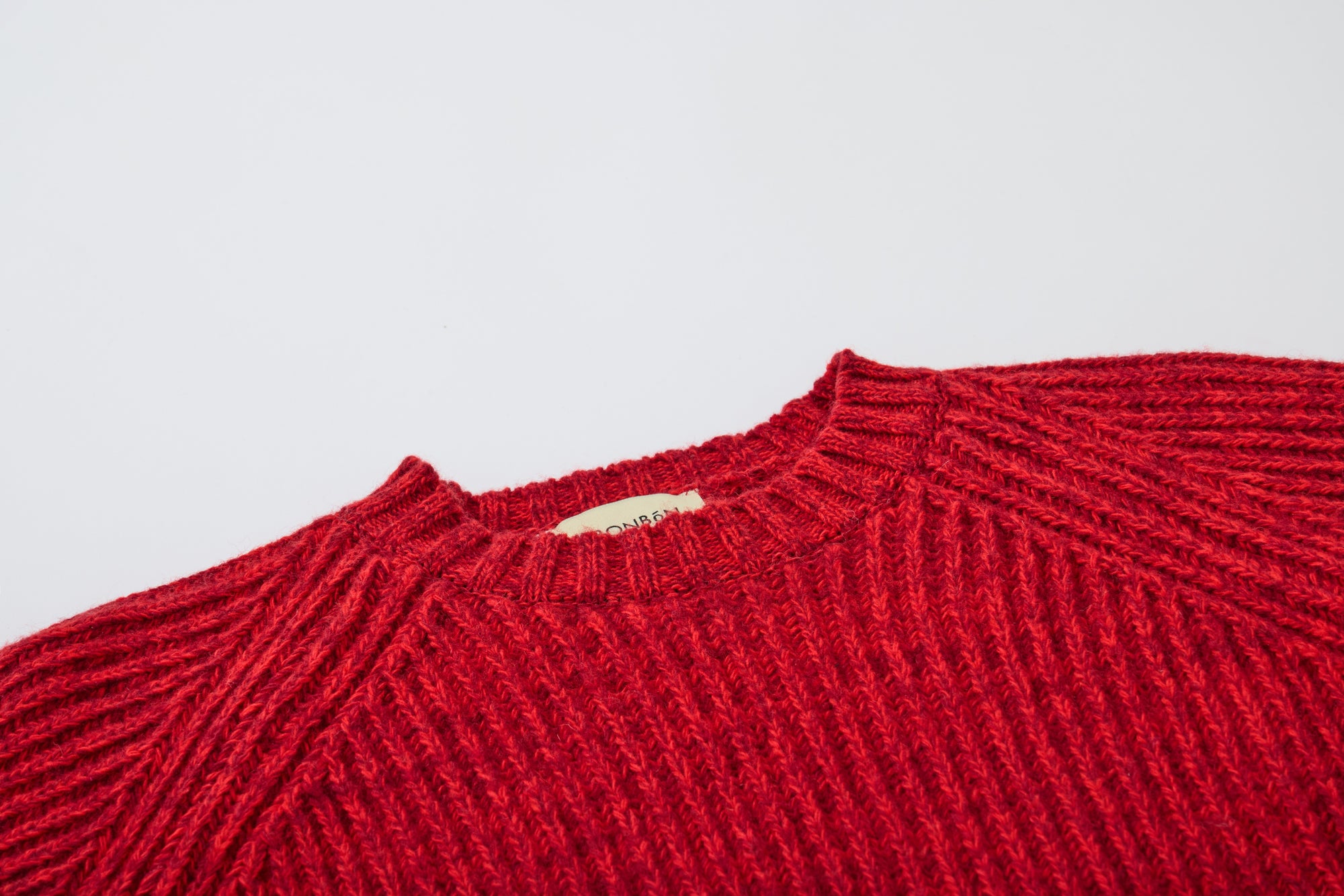 Red knitted sweater from MIBONBON