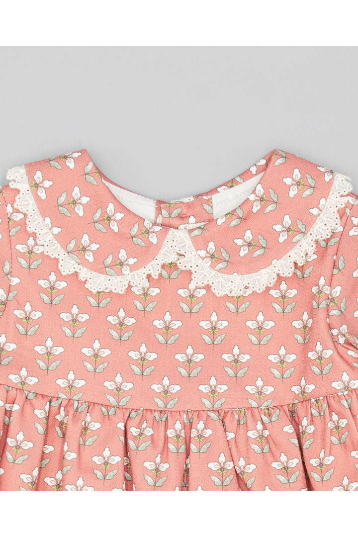 Garnet flannel dress with exclusive floral print.