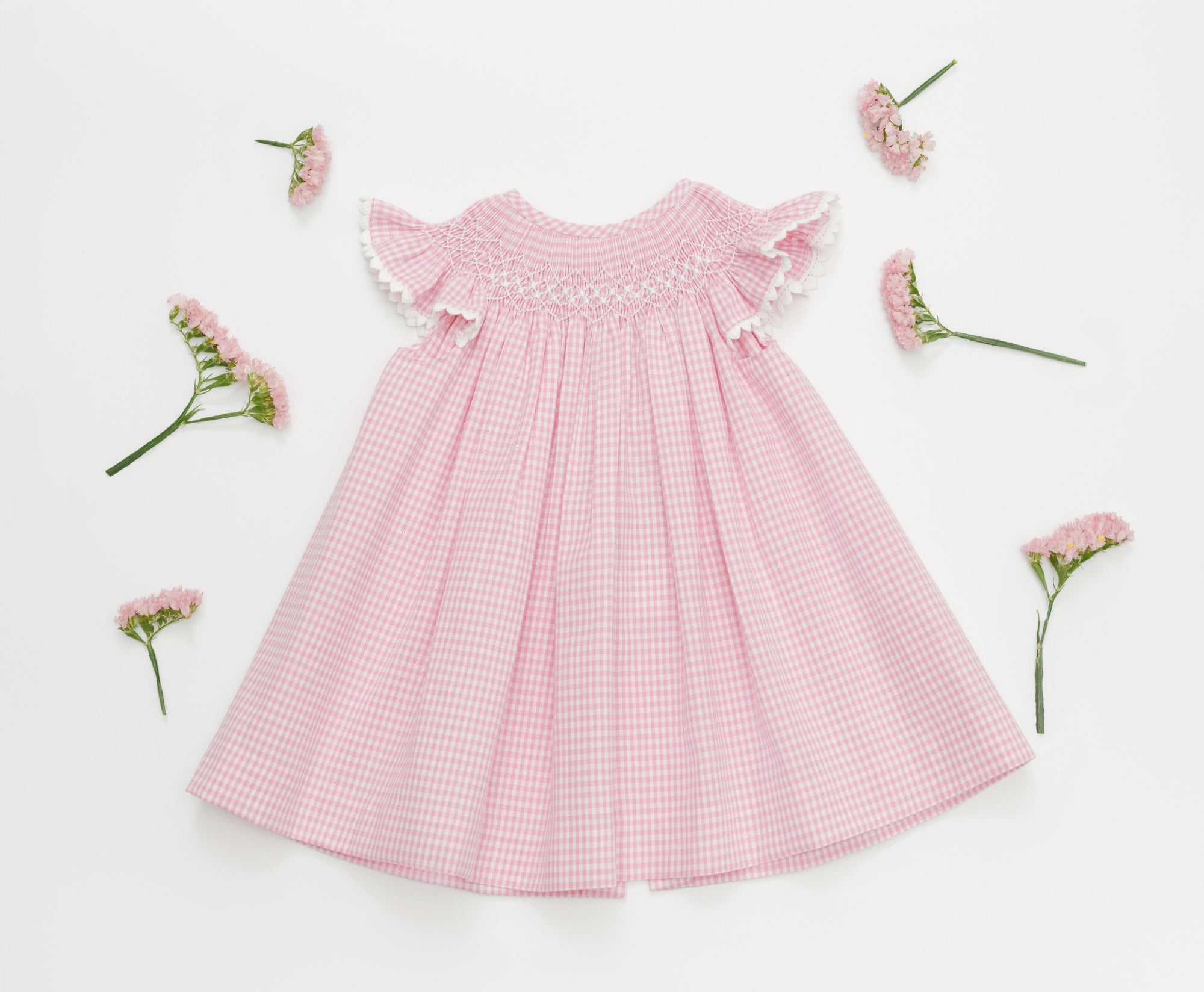 Light pink artisan dress for babies