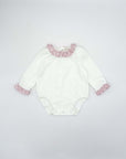 Bodysuit with ruffled trim on the collar and cuffs.