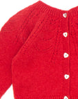 Red knitted cardigan with eyelets