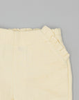 BEIGE TEXTURED TROUSERS WITH RUFFLES
