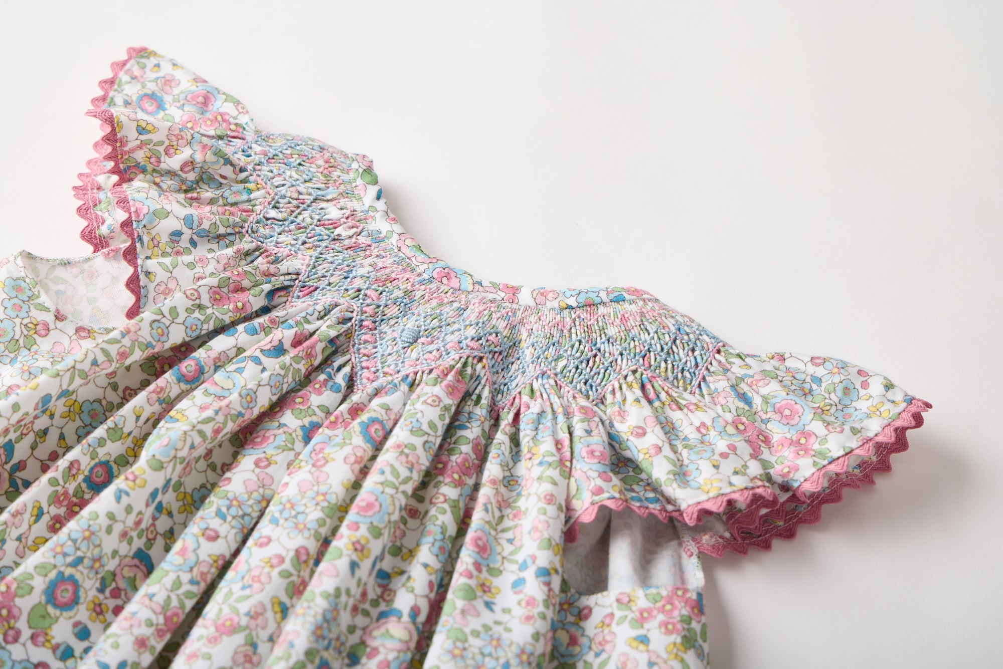 Smocked floral dress with Flutter sleeves