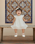 Baby Girl in Ivory Dress with Flat Shoes