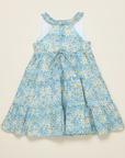 Back view product photo of blue floral dress on beige background