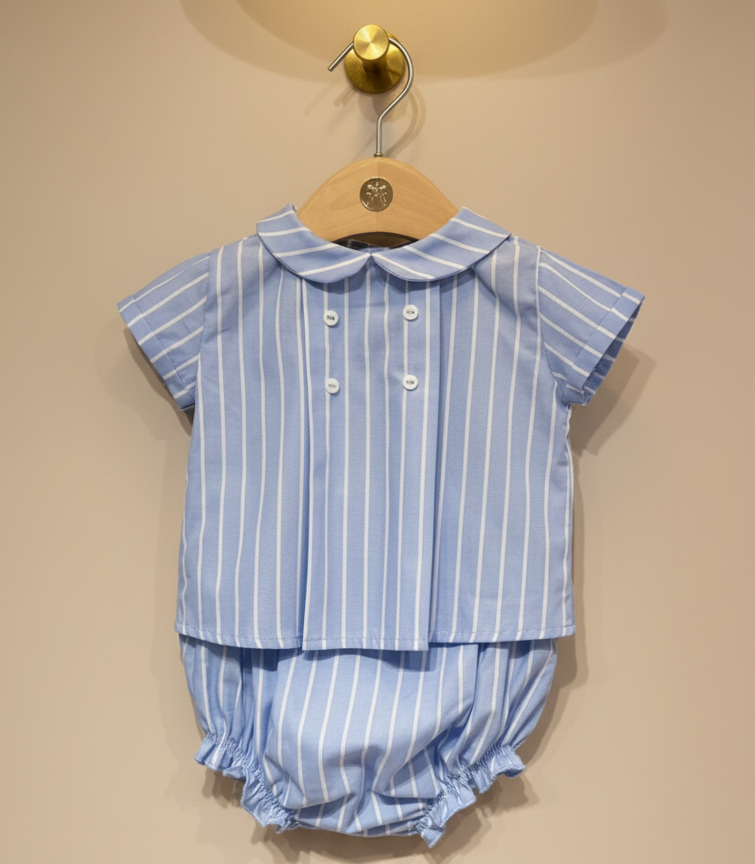 Blue striped baby set with matching collar on beige background