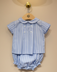 Blue striped baby set with matching collar on beige background